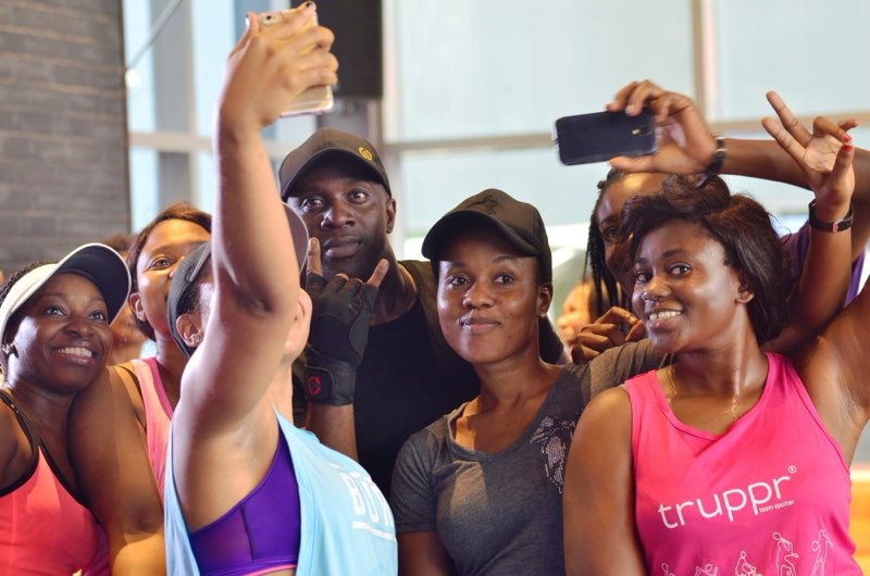 Participants squeeze in for a selfie with an Eden coach